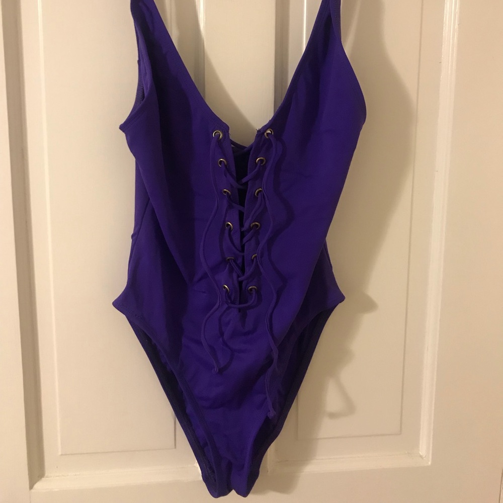 Purple lace up one piece bathing suit